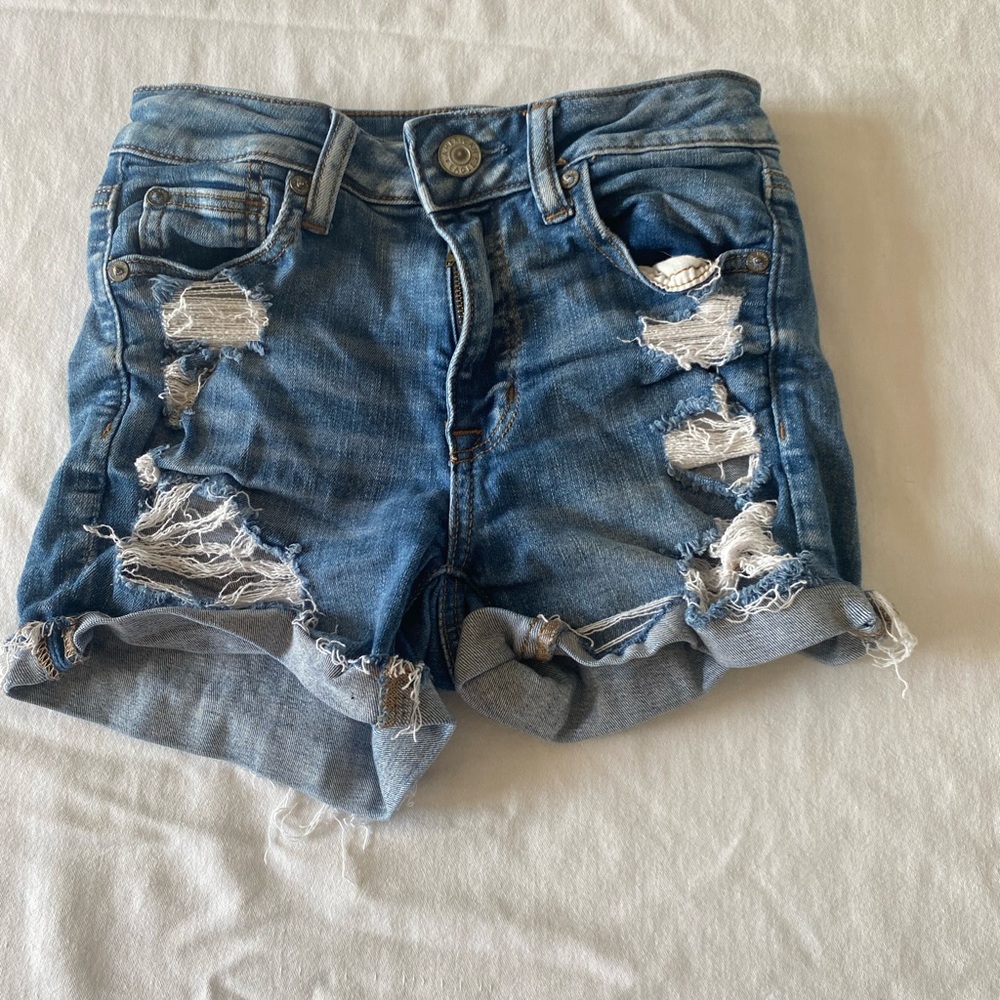 Blue distressed american eagle shorts